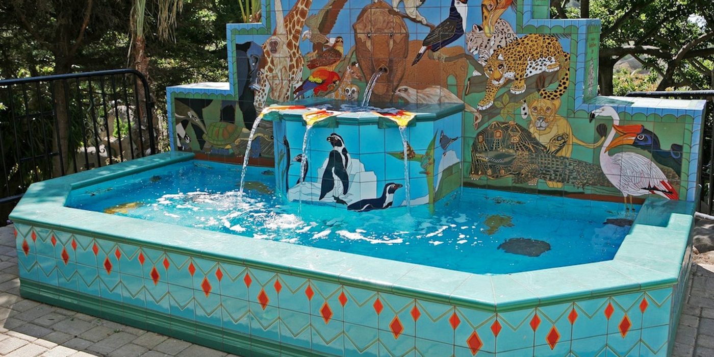 The Animal Kingdom Fountain at Santa Barbara Zoo: a turquoise tiled pool with penguins and animals.