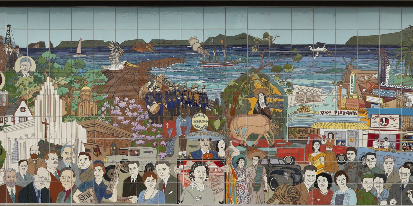 Detail of the Ventura Historic Mural: a crowd of townspeople, the Mission and the sea in glazed tile.